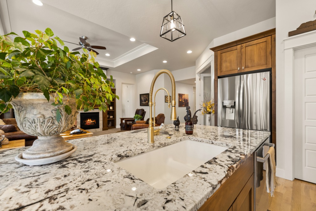 Seamless Gourmet Kitchen Interior with Granite Island and Gold Fixtures.jpg (1)